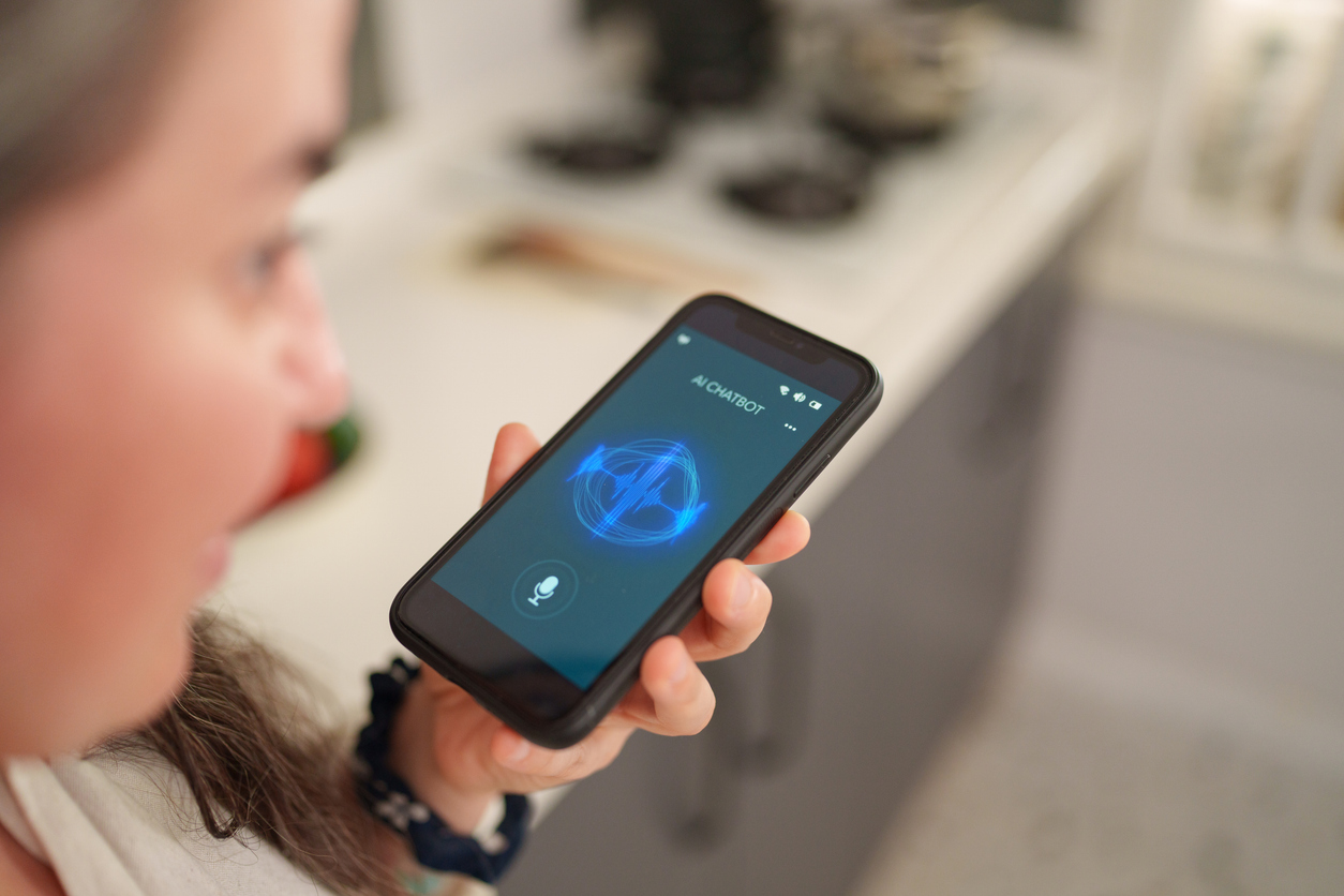 Woman using AI chatbot voice assistant on smartphone